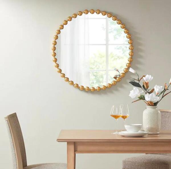 rounded mirror with golden frame
