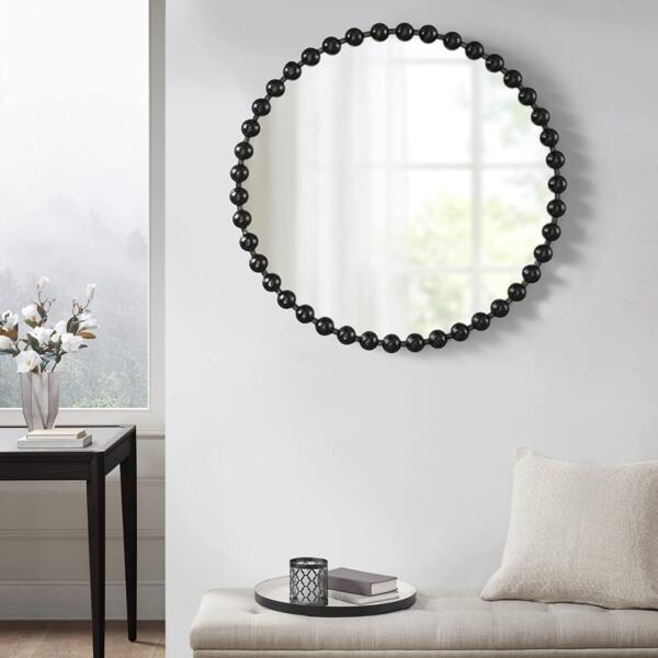 rounded mirror with golden frame